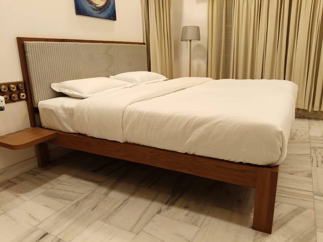 The Corner Suite at Shivbagh, a bright room with windows on two sides overlooking open fields
